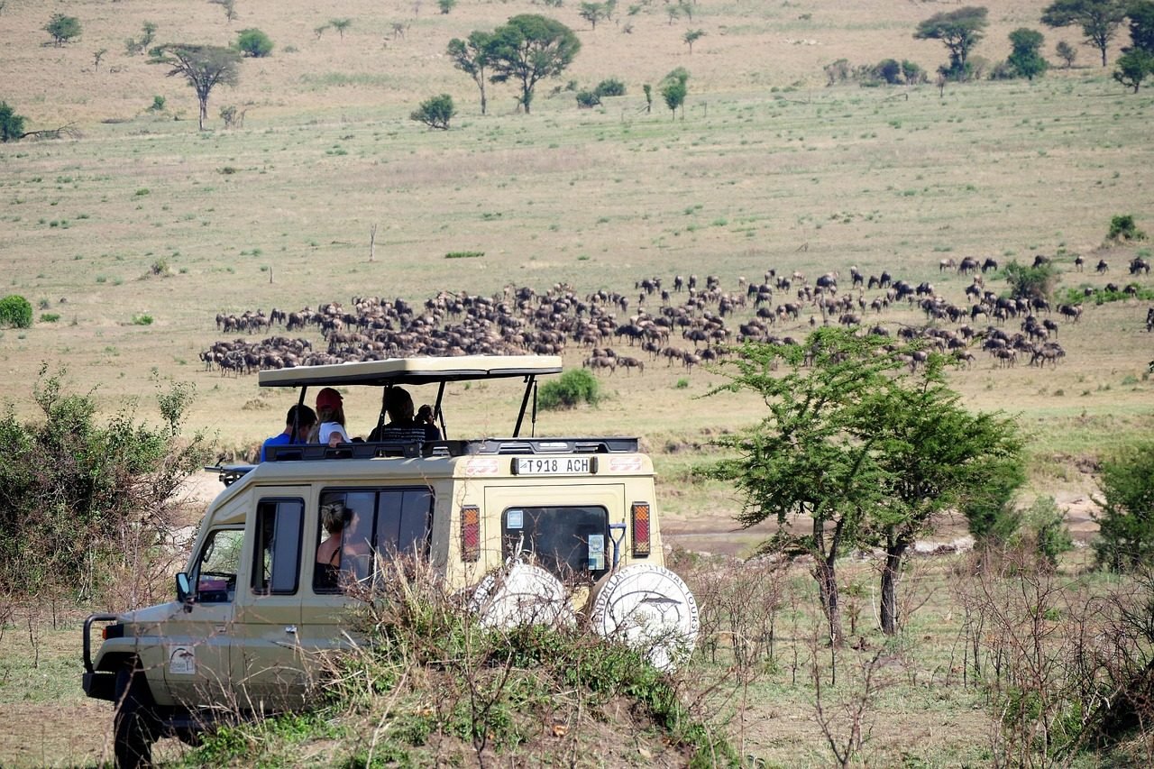 Safari vehicle on Tanzania plains for a safari and Zanzibar extension