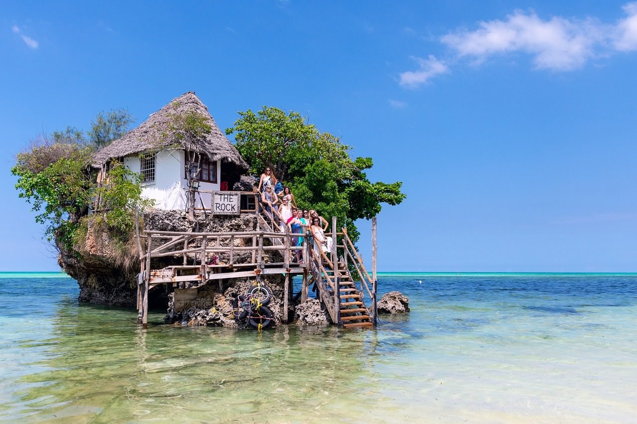 Small Zanzibar island building surrounded by clear ocean water
